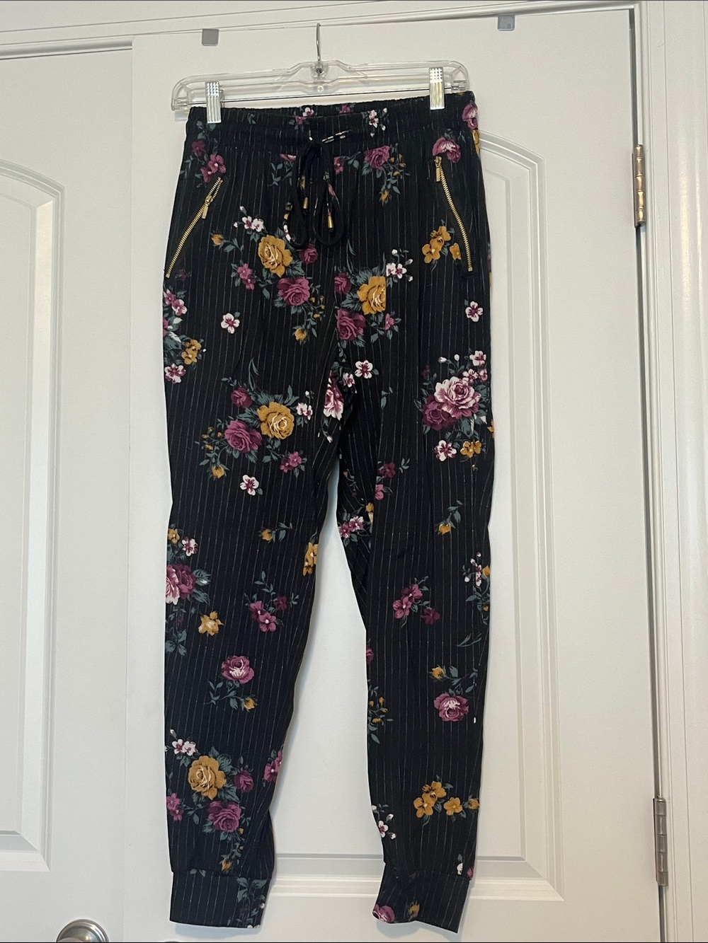 Black Floral Jogger Pants with Gold Zipper Accents
